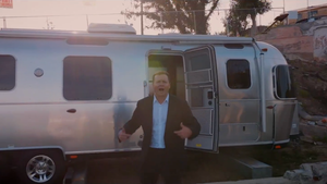 Spencer Pratt in front of his Airstream trailer in his "They not like us" campaign ad (Credit: Spencer Pratt/X)